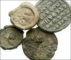 Lot of four Byzantine PB Seals. Four iconographic lead seals, from the early to late periods. Domed seal with panoply of arms, probably Roman // 15mm seal with military saint and fragmentary inscripti