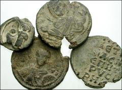 Lot of four Byzantine PB Seals. Four later iconographic lead seals. 15mm seal with figure keelingbefore Christ / Bust of Mary above monogram // 23mm seal with crude bust of the Virgin Mary, partially 