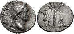 Roman Imperial Vespasian. AD 69-79. AR Denarius (16.5mm, 2.94 g, 5h). "Judaea Capta" commemorative. Antioch mint. Struck AD 72-73. Laureate head right / Palm tree; to left, Vespasian standing right, h