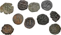 Large Lots BYZANTINE. Lot of ten (10) bronze issues. Includes: Justin II. Æ Decanummium (3) // Maurice Tiberius. Æ Decanummium (2) // Heraclius. Æ Half Follis // Constans II. Æ Follis // Justin II. Co