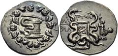 LYDIA, Tralleis. Circa 166-67 BC. AR Tetradrachm (27mm, 12.56 g, 1h). Cistophoric type. Ptol-, magistrate. Dated CY 4 (130 BC). Cista mystica with serpent; all within ivy wreath / Two serpents entwine