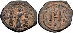 Heraclius, with Martina and Heraclius Constantine. 610-641. Æ Follis (26mm, 5.33 g, 7h). Constantinople mint, 3rd officina. Uncertain date. Heraclius, in center, flanked by Martina, on left, and Herac