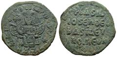 Byzantine Basil I, the Macedonian. 867-886. AE follis. Constantinople mint, 867-876. Basil enthroned facing, wearing crown and loros, and holding labarum and akakia;l throne has curved arms and orname