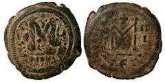Byzantine Justinian I, 527-565. Follis, Antioch (ANTIX?), overstruck with Heraclius, 610-641, Follis, Thessalonica. Follis (bronze, 10.88 g, 32 mm). Nearly very fine.
