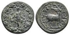 GREEK LYDIA, Hierocaesareia (AD 54-138). AE. Obv: Artemis standing front, looking left, holding bow, her right hand on the neck of a stag standing left behind her, all within laurel wreath. Rev: IEPOK