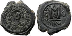 Byzantine Maurice Tiberius AE, Follis. (Bronze, 11.38 g. 30 mm) Nicomedia. 582-602 AD. Maurice Tiberius AE, Follis. (Bronze, 11.38 g. 30 mm) Nicomedia. 582-602 AD. Obv: D N mAV[RIC] TIb P . Helmeted a