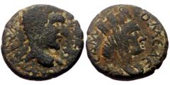 Roman Provincial Mesopotamia, Edessa. Macrinus. AE. (Bronze, 3.34 g. 16mm.) 217-218 AD. Obv: Legend illegible. Laureate head of Macrinus, right. Rev: ΟΜ ЄΔЄCCΑ Μ. Turreted and draped bust of Tyche rig