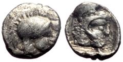 Greek Lycia, uncertain mint, AR obol (0.60g, 9mm) ca 440-380 BC Obv: Within incuse square a head of Herakles wearing lion's skin right Rev: Helmeted head of Athena right Ref: SNG Lockett 2998 var. (di