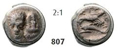 ISTROS Hemiobol (0,44g), 380-280H Hemiobol (0,44g), 380-280. Av. Two young male heads facing side-by-side, the left one inverted / Rv. IΣTP Sea-eagle left, grasping dolphin with talons, H in right fie