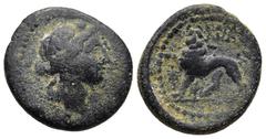 Greek LYDIA. Sardes. (Circa 133 BC). AE Bronze (18,1mm 4,3g) Obv: Head of Dionysos right, wearing ivy wreath Rev: Horned panther standing to left, head facing, holding broken spear in jaws; monograms 