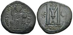 BYZANTINE & WORLD COINS JUSTINIAN I (527-565). Follis. Antioch. Obv: D N IVSTINIANVS P P AVG. Justinian enthroned facing, holding long sceptre and globe cruciger. Rev: Large M between star and crescen