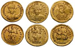 Lot of 3 late Roman gold solidi. All of Constantinople, all with helmeted bust three-quarters right. Honorius (AD 393–423), rev. Constantinopolis (2, RIC 24, DO 764, 764 var.). Theodosius II (AD 402–4