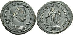 Nummus frappé à Londres à l’été 307.Buste barbu, lauré et cuirassé à droite. R/. Hercule de face, tenant la massue et la peau de lion. (RIC, n° 91). Billon. 6,96g. (6h). Superbe. Rare.