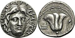 Tétradrachme, (230-205). A/. Tête d’Hélios presque de face. R/. Ameinias. Rose avec son bouton et proue à gauche. - Références : BMC, n° 120 - SNG, Delepierre, n° 3761SNG, Keckman, n° 542- Sear, n° 54