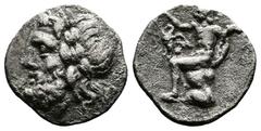 Greek Arcadia, Megalopolis, 175-168 BC. AR Triobol (17 mm, 2,23 g.). 175-168 BC. Laureate head of Zeus to left. Rev. Pan seated left on rock, raising his right hand above eagle standing in his lap, an