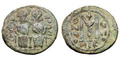 Pre-reform Coinage of Bilad al-Sham. Arab-Byzantine. Follis, 7.90g. (h). Jund Al-Urdunn, Nysa Scythopolis (Beisan), c. 670-690 AD. Obv: CKYΘO ΠOΛHC on sides of figures of Justin II and Sophia. Rx: Lar