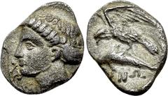 Greek Coins PAPHLAGONIA. Sinope. Trihemiobol (Circa 410-350 BC). Obv: Head of nymph left, with hair in sakkos; aphlaston to left. Rev: ΣINΩ. Sea-eagle standing left, with wings spread, on dolphin left