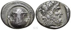 Greek Coins BOEOTIA. Thebes. Stater (425-395 BC). Obv: Boeotian shield; club across upper half. Rev: Θ - E. Bearded head of Dionysos right, wearing ivy wreath within incuse square. BCD Boiotia 436; My