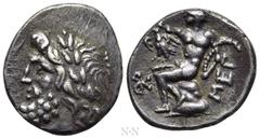 Greek Coins ARKADIA. Arkadian League. Megalopolis. Triobol or Hemidrachm (Circa 175-168 BC). Obv: Laureate head of Zeus left. Rev: MEΓ. Pan seated left on rock, raising arm and holding lagobolon; eagl