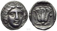 Greek Coins CARIA. Rhodes. Tetradrachm (Circa 408-400 BC). Obv: Bare head of Helios facing slightly right. Rev: POΔION. Rose with bud to right; to left, grain ear above letter Z; all within square inc