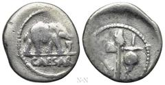 Roman Republican Coins JULIUS CAESAR. Denarius (49 BC). Military mint traveling with Caesar. Obv: CAESAR. Elephant advancing right, trampling upon horned serpent. Rev: Emblems of the pontificate: simp