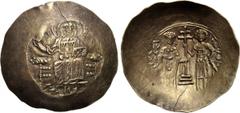 JOHN II COMNENUS (1118-1143). EL Aspron Trachy. Constantinople. Obv: Christ enthroned facing, raising hand in benediction and holding Gospels. Rev: John and St. George standing facing, supporting betw