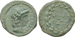 LYDIA. Tralles (as Caesarea). Pseudo-autonomous. Ae (Circa 27 BC-69 AD). Obv: KAIΣΑΡΕΩΝ. Laureate head of Apollo right. Rev: NIKOM / HΔHΣ. Legend in two lines within wreath. RPC 2642. Condition: Very 