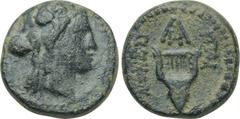 LYDIA. Kaystrianoi. Ae (2nd-1st centuries BC). Obv: Head of Dionysos right, wearing ivy wreath. Rev: Lyre in the form of a bukranion. Control: monogram. Cf. SNG von Aulock 2988; cf. SNG Copenhagen 104