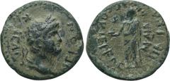 LYDIA. Uncertain. Nero (54-68). Ae. Obv: NEPΩΝ ΚΑΙCAP. Laureate head right. Rev: Uncertain figure standing left, holding bust. RPC -. An apparently unpublished type, though the style closely resembles