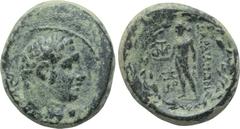 LYDIA. Sardes. Ae (2nd-1st centuries BC). Obv: Laureate head of Herakles right. Rev: ΣAPΔIANΩN. Apollo standing left, holding raven and branch; monograms to left; all within wreath. SNG von Aulock 313