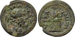 LYDIA. Hyrcanis. Pseudo-autonomous. Time of Commodus to Caracalla (177-217). Ae. Obv: MAKЄΔONΩ. Mask of Silenos right, with ivy wreath. Rev: VPKANΩN. Cista mystica, with serpent rising from upper righ