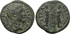 LYDIA. Philadelphia. Septimius Severus (193-211). Ae. Obv: AV K Λ CЄOVHPOC. Laureate head right. Rev: ΦIΛAΔЄΛΦЄΩ / N. Two Nemeses standing facing one another, each raising hand to head; wheel between.