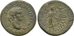 LYDIA. Tralles. Domitian (81-96). Ae. Obv: ΔOMITIANOC KAICAP CЄBACTOC ΓЄPMAN. Laureate head right. Rev: TPAΛΛIANΩN ΠΥΘIOC. Apollo standing left, holding branch and lyre. RPC II 1096; SNG von Aulock 32
