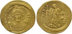 Byzantine Coins JUSTINIAN I (527-565). GOLD Solidus. Constantinople. Obv: D N IVSTINIANVS P P AVG. Helmeted and cuirassed bust facing, holding globus cruciger and shield with horseman motif. Rev: VICT