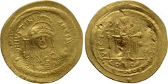 Byzantine Coins JUSTINIAN I (527-565). GOLD Solidus. Constantinople. Obv: D N IVSTINIANVS P P AVG. Helmeted and cuirassed bust facing, holding globus cruciger and shield with horseman motif. Rev: VICT
