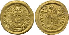 Byzantine Coins JUSTINIAN I (527-565). GOLD Solidus. Constantinople. Obv: D N IVSTINIANVS P P AVG. Helmeted and cuirassed bust facing, holding globus cruciger and shield with horseman motif. Rev: VICT