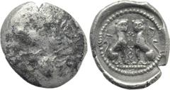 Greek Coins DYNASTS OF LYCIA. Time of Wekhssere II (Circa 400-380 BC). Diobol. Tlos. Obv: Helmeted head of Athena right [degraded to mostly plain surface]. Rev: T - Λ. Two panthers seated facing one a