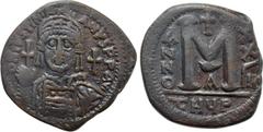 Byzantine Coins JUSTINIAN I (527-565). Follis. Antioch. Dated RY 28 (554/5). Obv: D N IVSTINIANVS P P AVG. Helmeted and cuirassed bust facing, holding globus cruciger and shield decorated with horsema