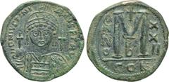 Byzantine Coins JUSTINIAN I (527-565). Follis. Constantinople. Dated RY 22 (548/9). Obv: D N IVSTINIANVS P P AVG. Helmeted, draped and cuirassed bust facing, holding globus cruciger and shield decorat