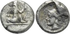 Greek Coins CILICIA. Uncertain. Tetartemorion (4th century BC). Obv: Persian king or hero in kneeling-running stance right, holding dagger and bow. Rev: Helmeted head of Athena left within incuse circ