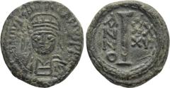 Byzantine Coins JUSTINIAN I (527-565). Decanummium. Ravenna. Dated RY 36 (562/3). Obv: D N IVSTINIANVS P P AV. Helmeted and cuirassed bust facing, holding globus cruciger. Rev: Large I; A/N/N/O - XX/X