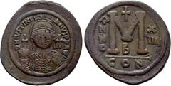Byzantine Coins JUSTINIAN I (527-565). Follis. Constantinople. Obv: D N IVSTINIANVS P P AVI. Helmeted, draped and cuirassed bust facing, holding globus cruciger and shield with equestrian illustration