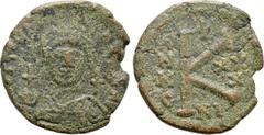 Byzantine Coins JUSTINIAN I (527-565). Half Follis. Nicomedia. Dated RY 30 (556/7). Obv: D N IVSTINIANVS P P AVG. Helmeted and cuirassed bust facing, holding globus cruciger and shield decorated with 