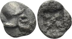 Greek Coins IONIA. Uncertain. Tetartemorion (5th century). Obv: Helmet right. Rev: Star of four rays, with pellet at center; all within incuse square. Leu E-1, lot 572. Rare Condition: Near very fine.
