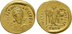 Byzantine Coins JUSTINIAN I (527-565). GOLD Solidus. Constantinople. Obv: D N IVSTINIANVS P P AVG. Helmeted and cuirassed bust facing slightly right, holding spear and shield decorated with horseman m