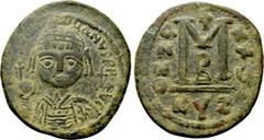 Byzantine Coins JUSTINIAN I (527-565). Follis. Cyzicus. Dated RY 25 (551/2). Obv: D N IVSTINIANVS P P AVG. Helmeted and cuirassed bust facing, holding globus cruciger and shield decorated with horsema