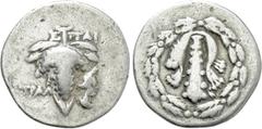 Greek Coins LYDIA. Tralleis. Cistophoric Drachm (Circa 166-67 BC). Spai-, magistrate. Obv: Lion skin draped over club; all within ivy wreath. Rev: TPAΛ. Grape bunch on vine; ΣΠΑΙ above, uncertain cont