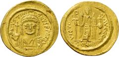 Byzantine Coins JUSTINIAN I (527-565). GOLD Solidus. Constantinople. Obv: D N IVSTINIANVS P P AVG. Helmeted and cuirassed bust facing, holding globus cruciger and shield decorated with horseman motif.