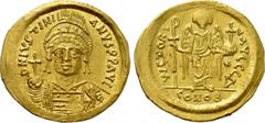 Byzantine Coins JUSTINIAN I (527-565). GOLD Solidus. Constantinople. Obv: D N IVSTINIANVS P P AVG. Helmeted and cuirassed bust facing, holding globus cruciger and shield decorated with horseman motif.