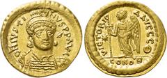 Byzantine Coins JUSTINIAN I (527-565). GOLD Solidus. Constantinople. Obv: D N IVSTINIANVS P P AVG. Helmeted and cuirassed bust facing slightly right, holding spear and shield decorated with horseman m